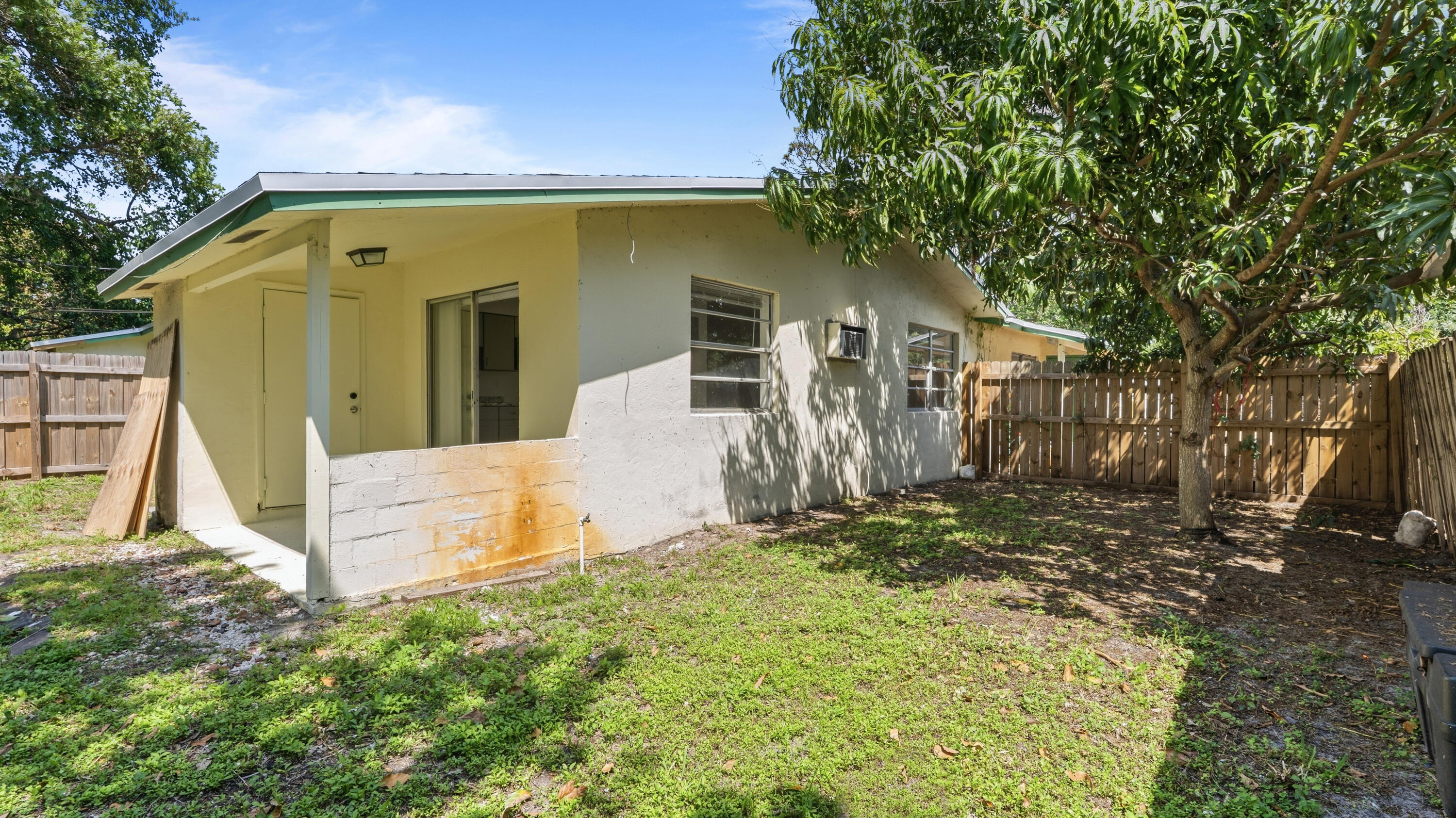 4453 Stevens Road Lake Worth Beach, FL 33461 - Photo 58 of 67 a view of a back yard of the house