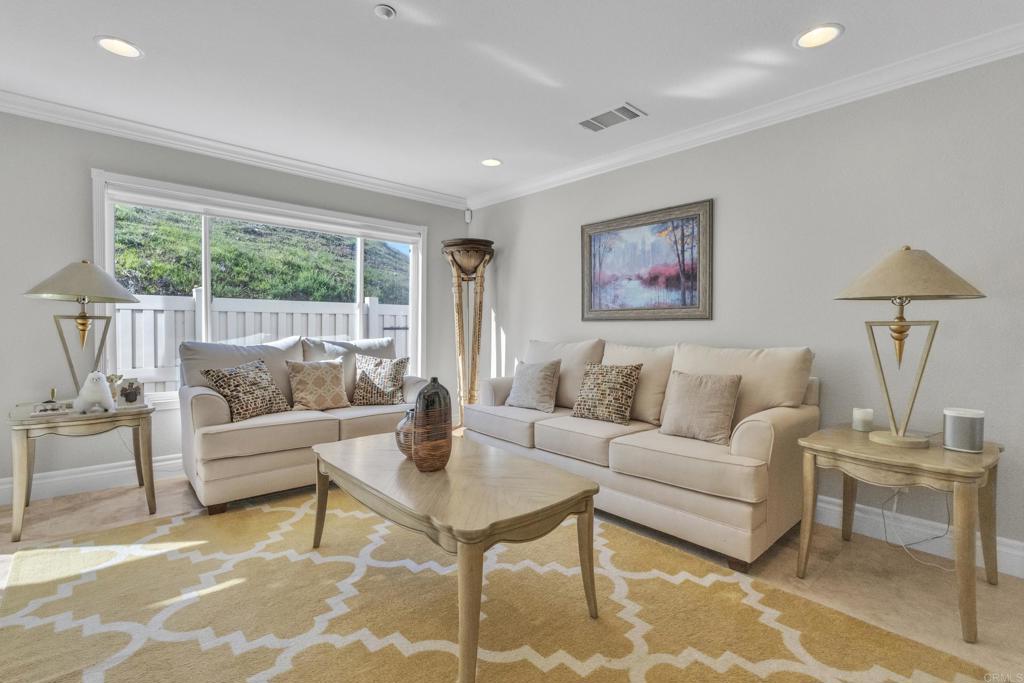 10403 Valley Waters Drive Spring Valley, CA 91978 - Photo 11 of 40 a living room with furniture and a large window