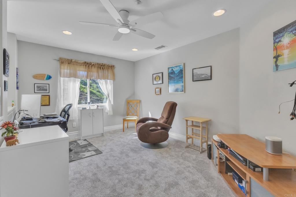 10403 Valley Waters Drive Spring Valley, CA 91978 - Photo 19 of 40 a living room with furniture and a window