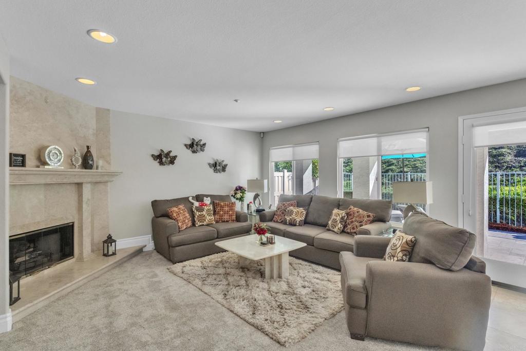 10403 Valley Waters Drive Spring Valley, CA 91978 - Photo 23 of 40 a living room with furniture and a fireplace