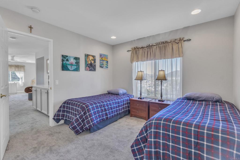 10403 Valley Waters Drive Spring Valley, CA 91978 - Photo 24 of 40 a bedroom with bed and walk in closet