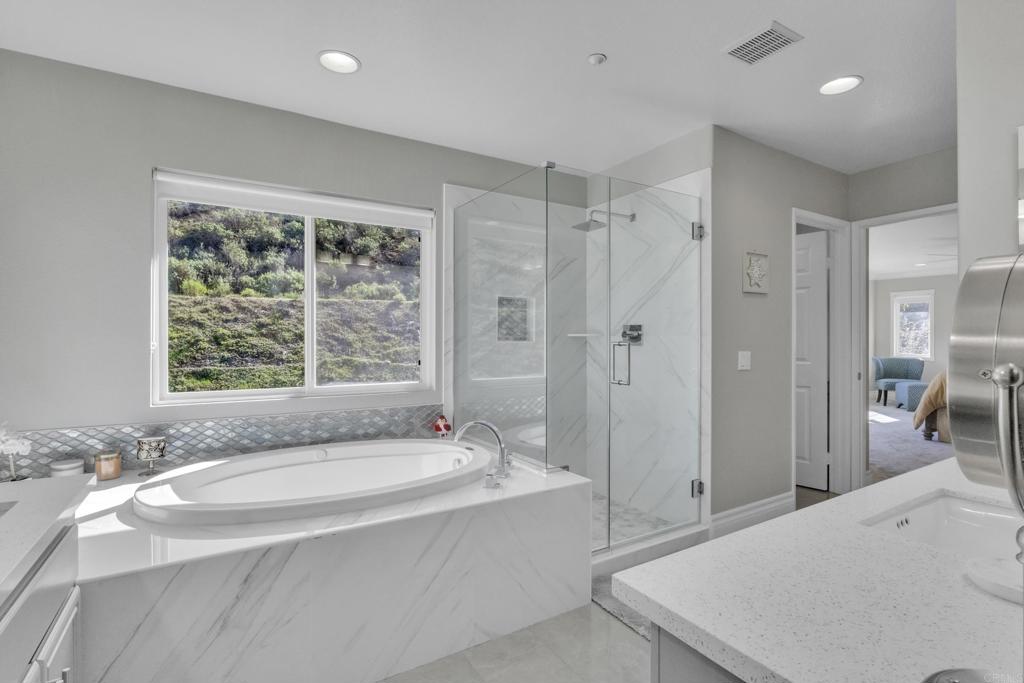 10403 Valley Waters Drive Spring Valley, CA 91978 - Photo 31 of 40 a spacious bathroom with sink shower and bathtub