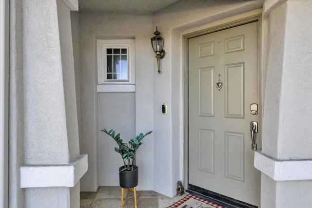 a view of a hallway with potted plant