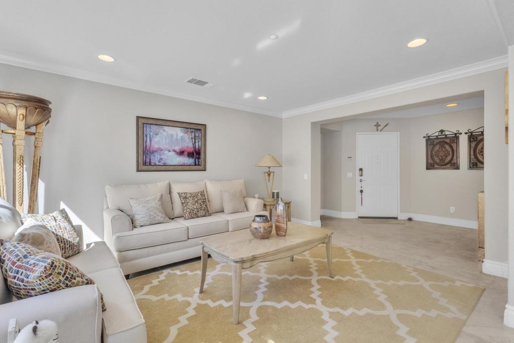 10403 Valley Waters Drive Spring Valley, CA 91978 - Photo 8 of 40 a living room with furniture and a view of kitchen