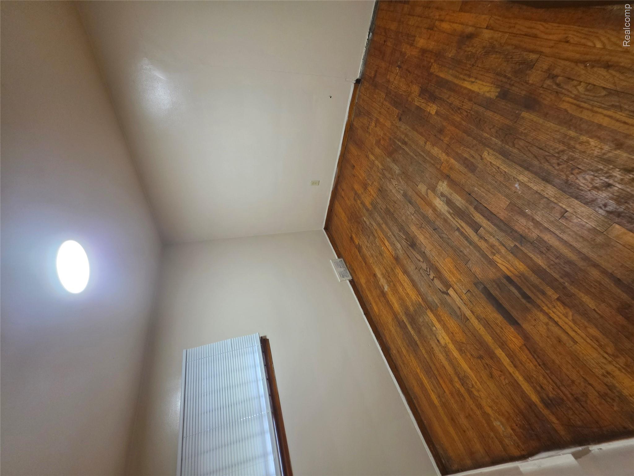 18539 Lahser Road Detroit, MI 48219 - Photo 13 of 23 Wood-finish flooring, white walls, and a recessed ceiling light