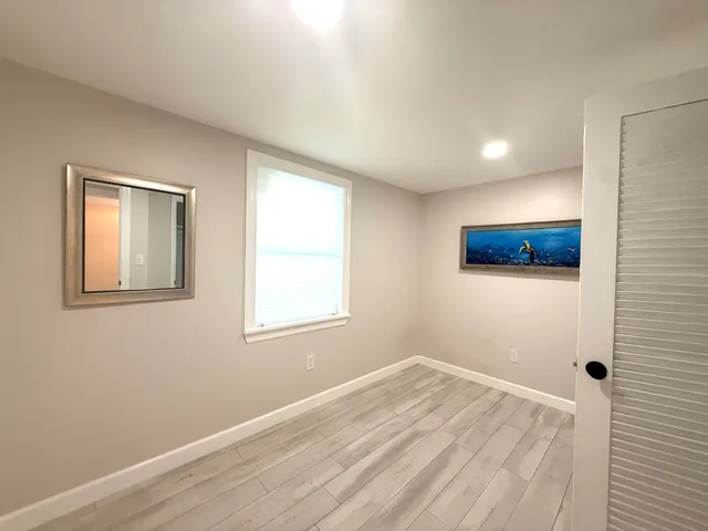 a view of a room that has a window in it