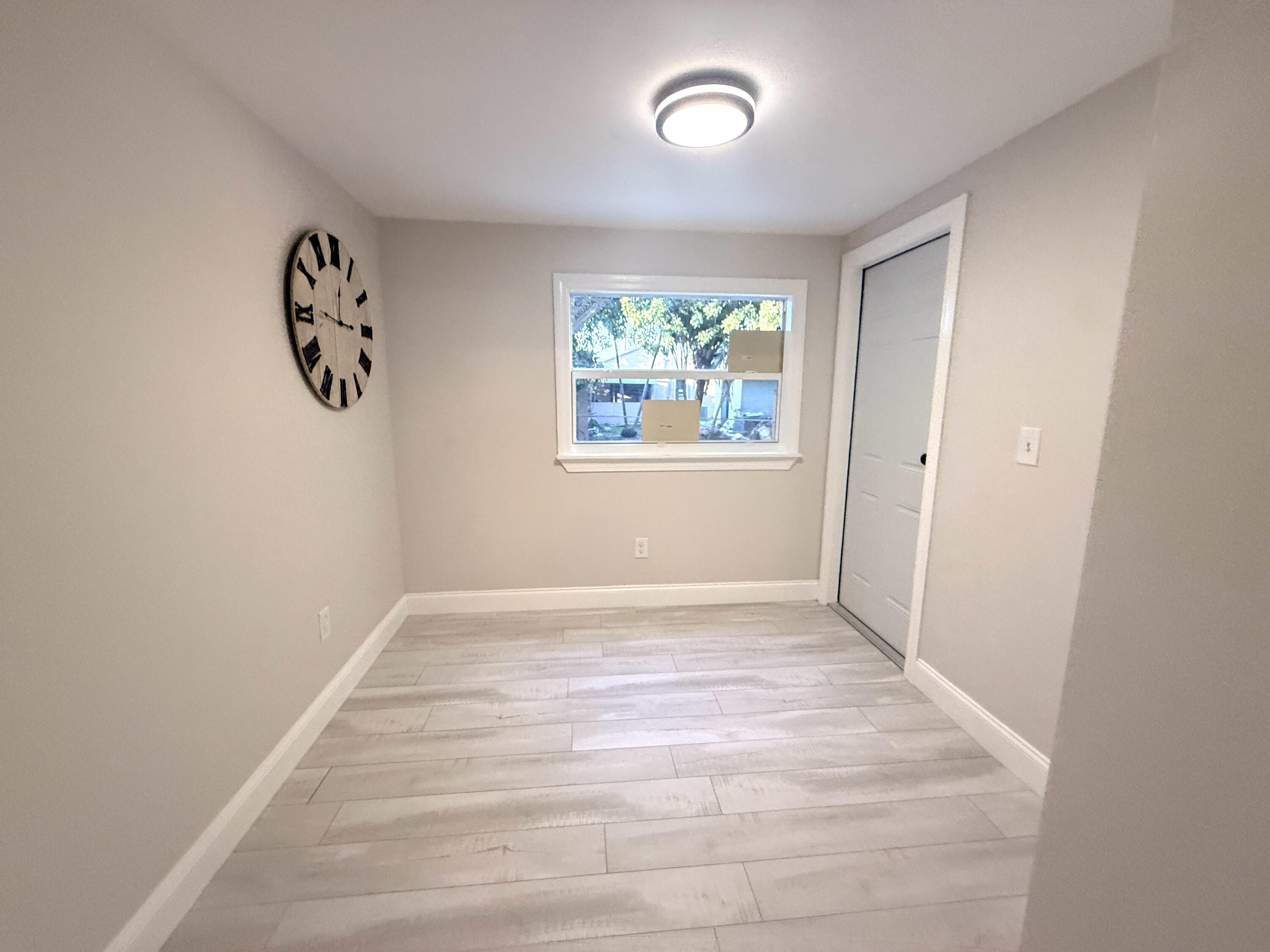 1093 Highview Road Lantana, FL 33462 - Photo 16 of 34 an empty room with windows