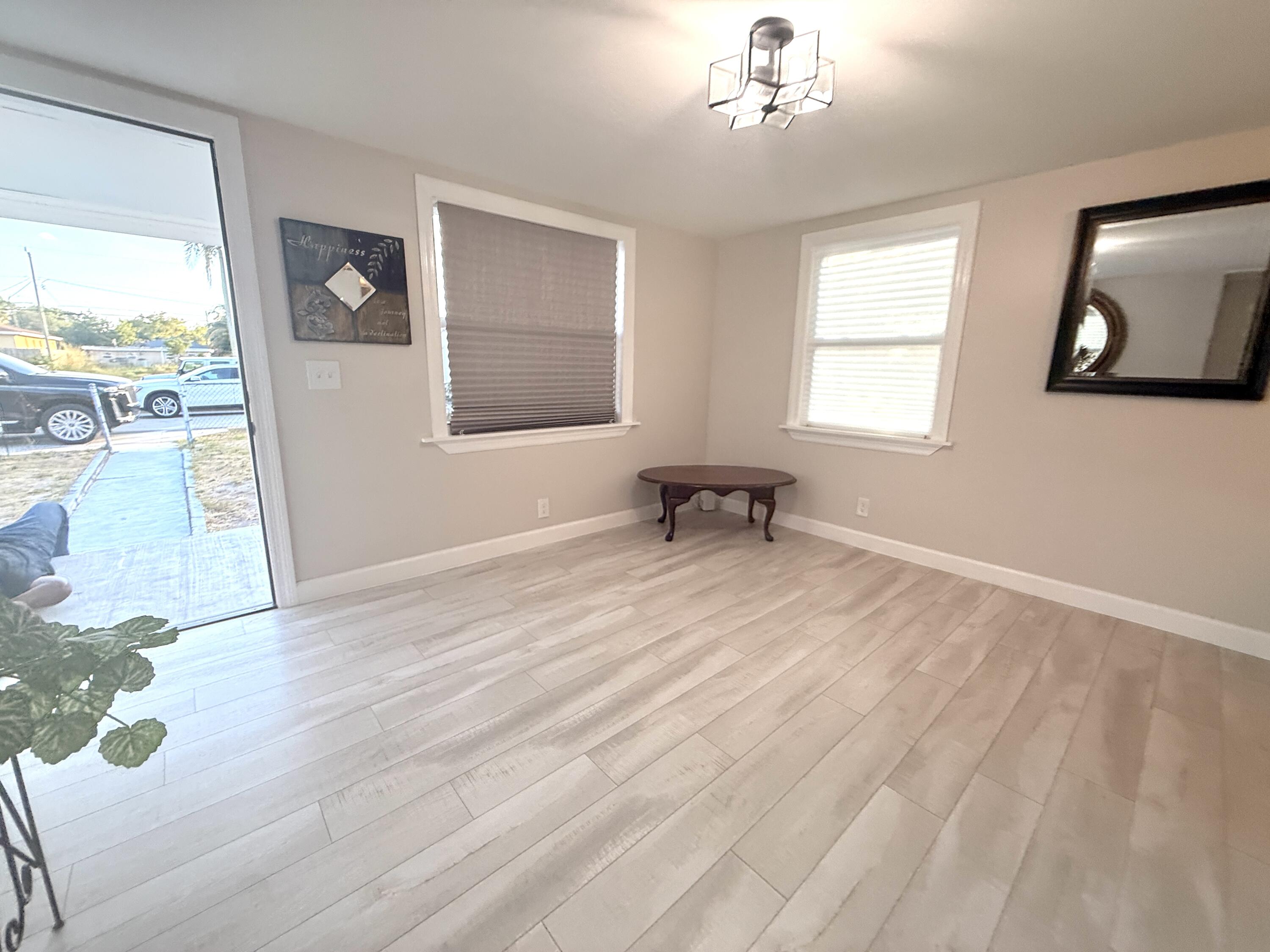 1093 Highview Road Lantana, FL 33462 - Photo 18 of 34 a view of an empty room with a window