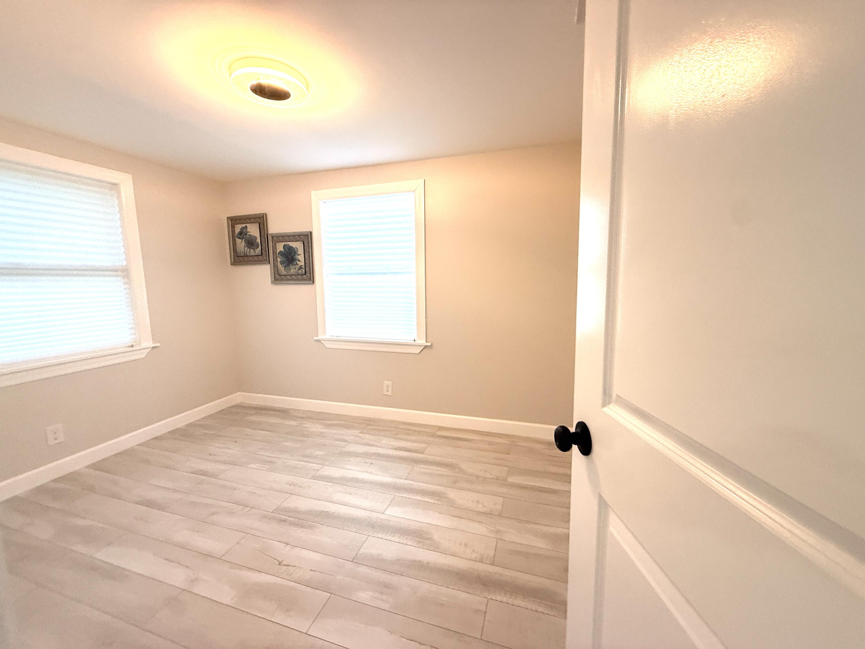 1093 Highview Road Lantana, FL 33462 - Photo 21 of 34 a view of an empty room with a window