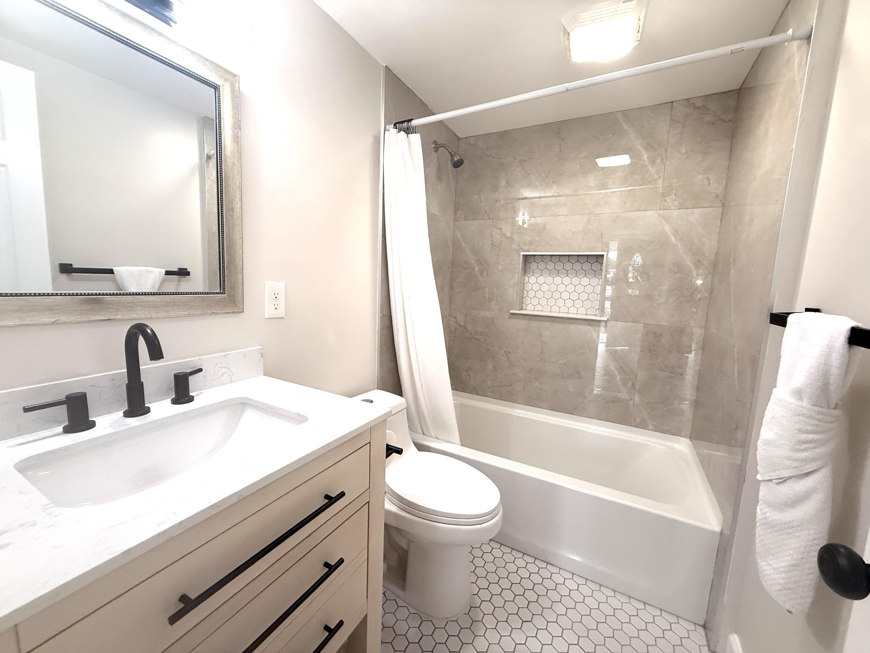 1093 Highview Road Lantana, FL 33462 - Photo 30 of 34 a bathroom with a sink toilet and shower