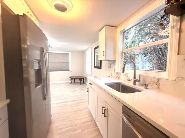 a kitchen with a sink and a window