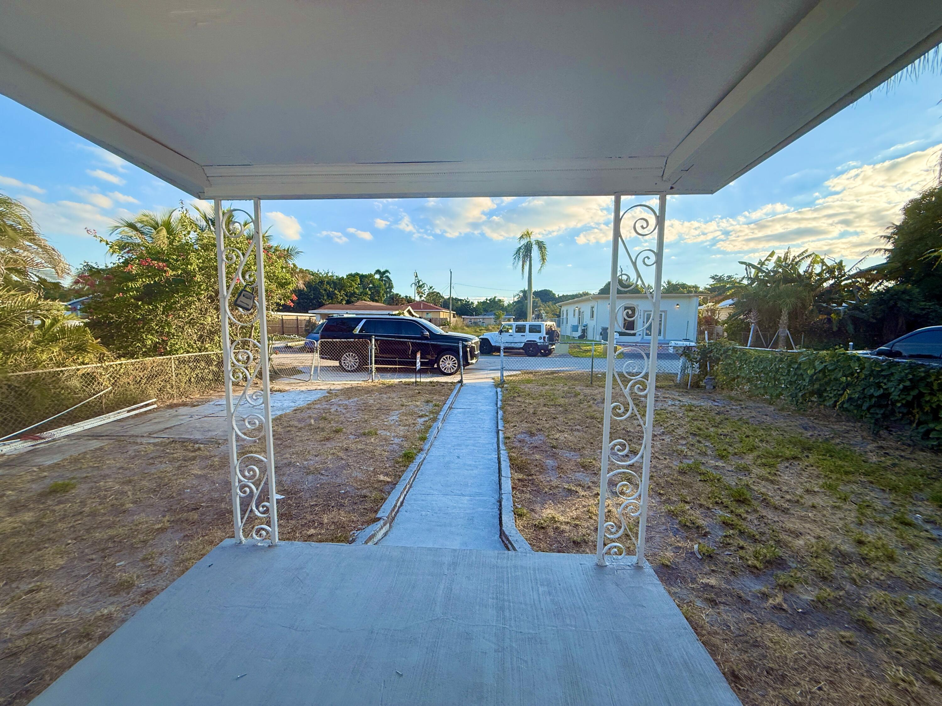 1093 Highview Road Lantana, FL 33462 - Photo 34 of 34 a view of a porch with wooden floor and outdoor space