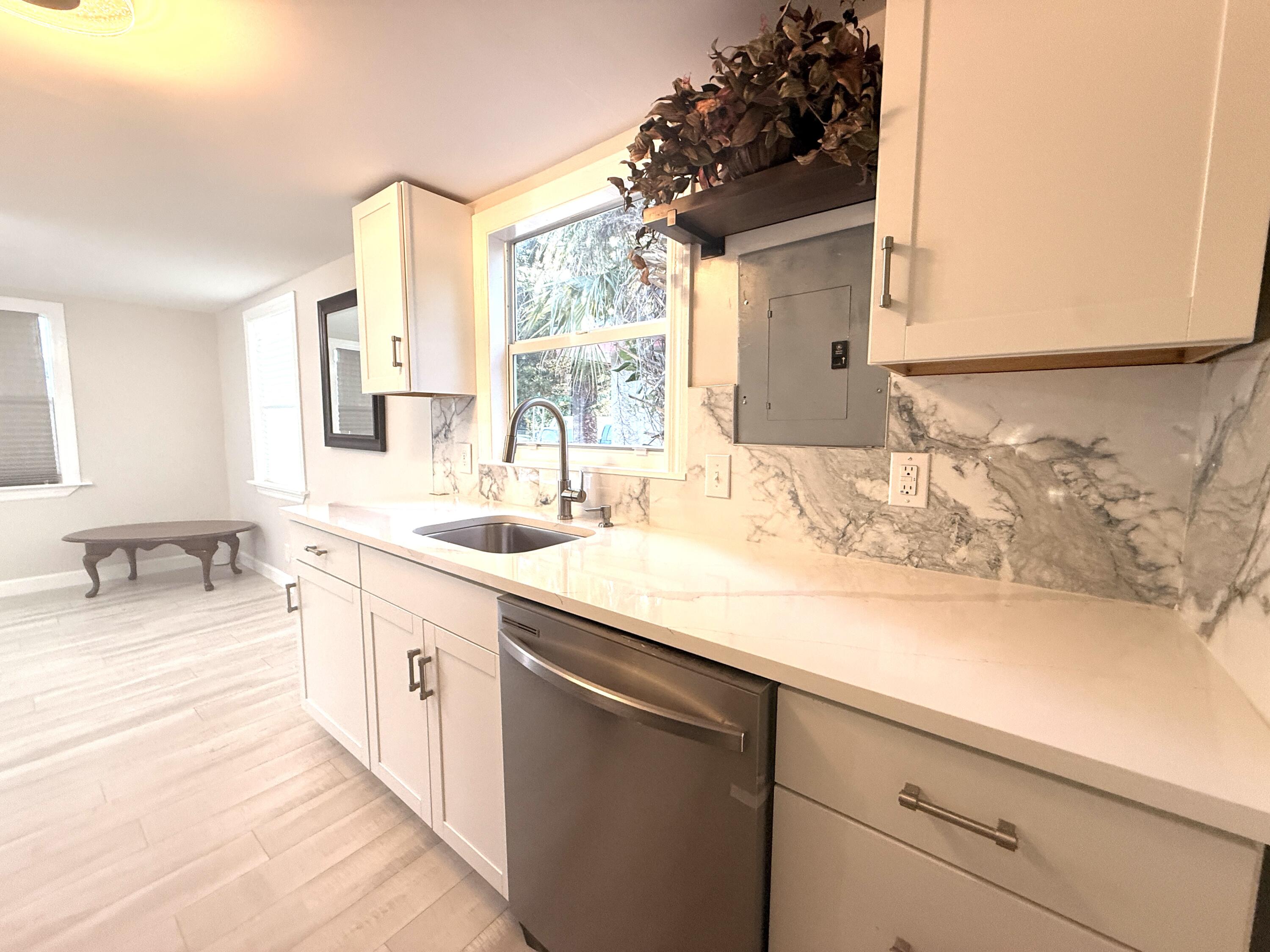 1093 Highview Road Lantana, FL 33462 - Photo 5 of 34 a bathroom with a sink and a bathtub