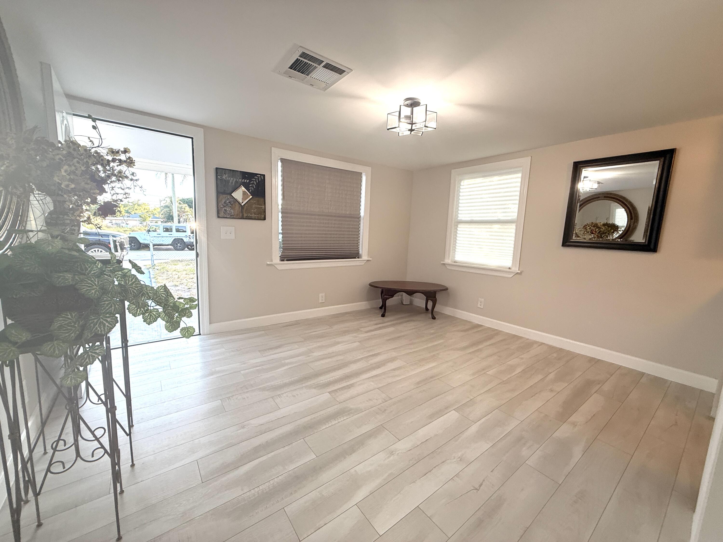 1093 Highview Road Lantana, FL 33462 - Photo 10 of 34 a view of an empty room and window