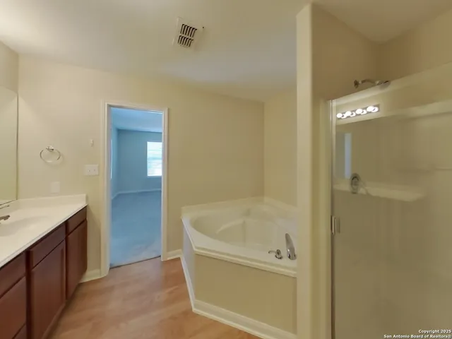 a bathroom with a bathtub and a sink