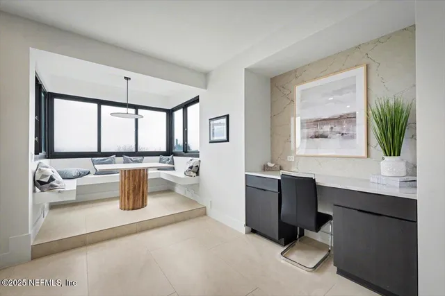 a bedroom with a bed and a ceiling fan