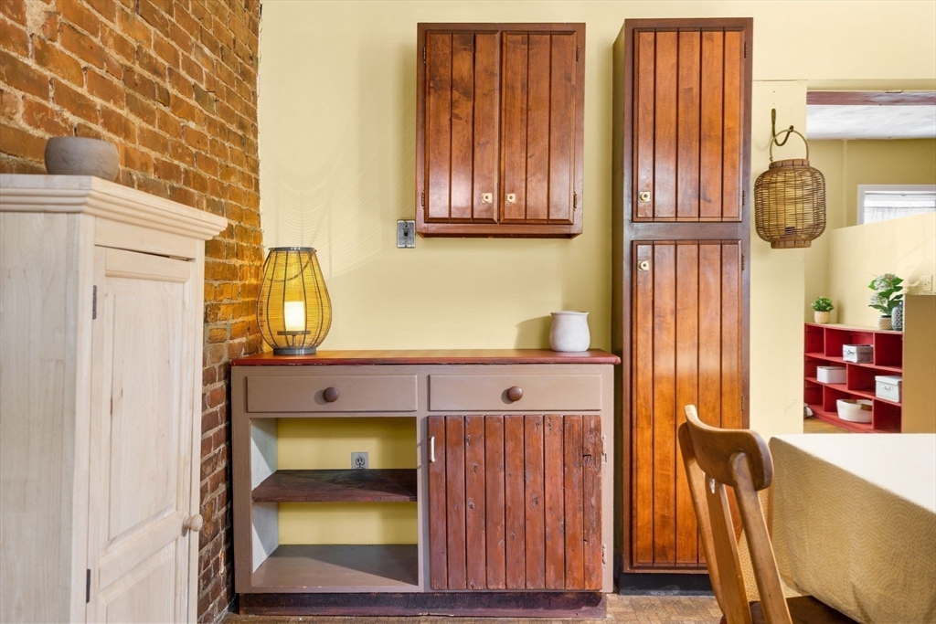 2 Livermore Place Cambridge, MA 02141 - Photo 7 of 20 view of hall way with furniture and paintings on the wall