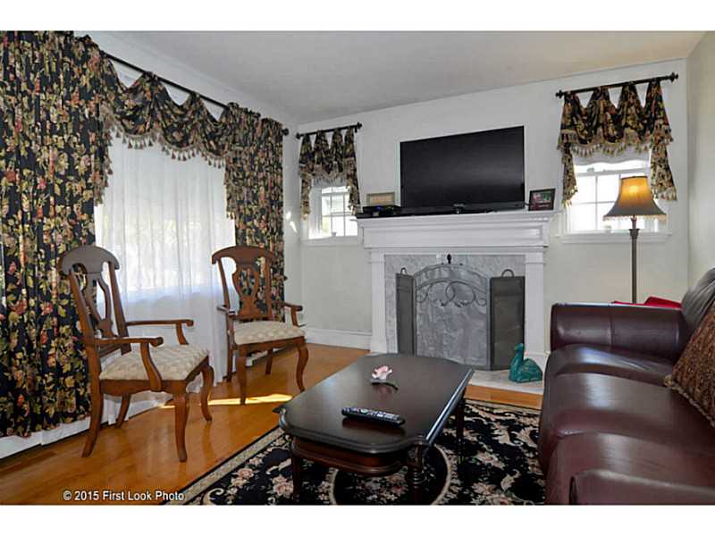 34 Rice Street Pawtucket, RI 02861 - Photo 4 of 25 Living Room. gleaming hardwoods and a marble fireplace