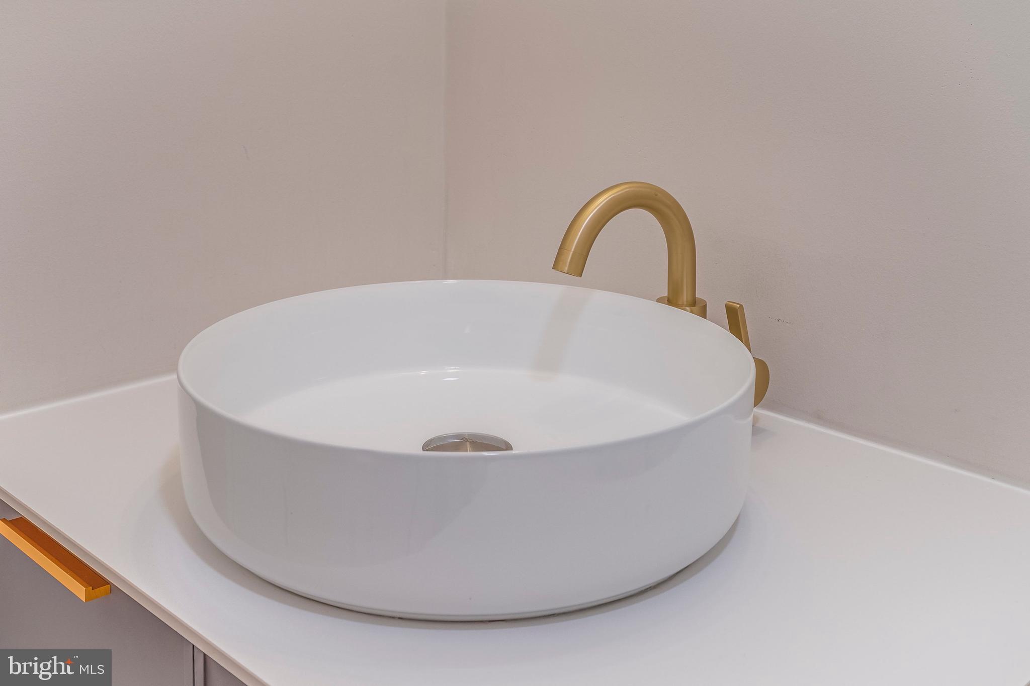 15001 Peach Orchard Road Silver Spring, MD 20905 - Photo 12 of 63 a white bath tub sitting in a bathroom