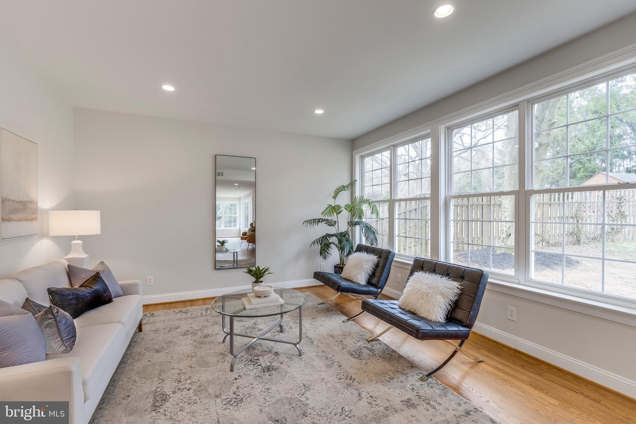15001 Peach Orchard Road Silver Spring, MD 20905 - Photo 14 of 63 a living room with furniture and a large window