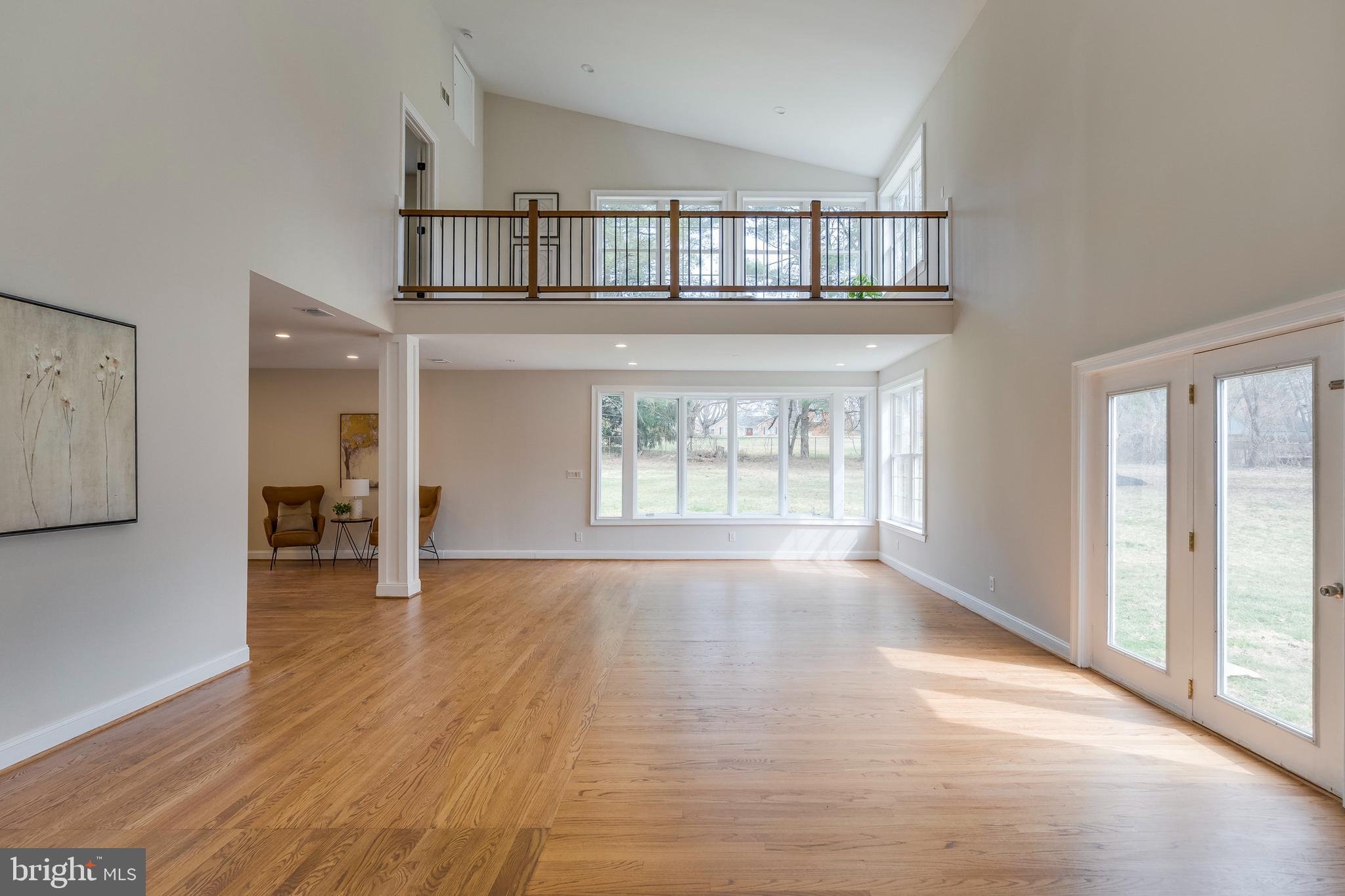 15001 Peach Orchard Road Silver Spring, MD 20905 - Photo 20 of 63 a view of an empty room with wooden floor and a window