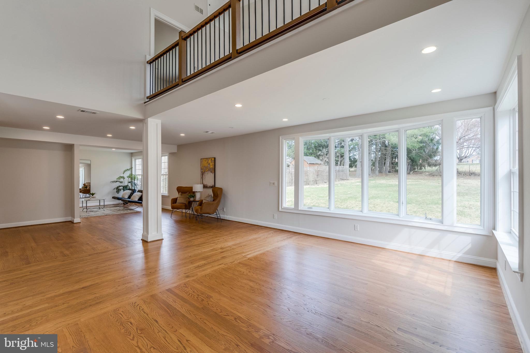 15001 Peach Orchard Road Silver Spring, MD 20905 - Photo 22 of 63 a view of a living room a dining room and wooden floor