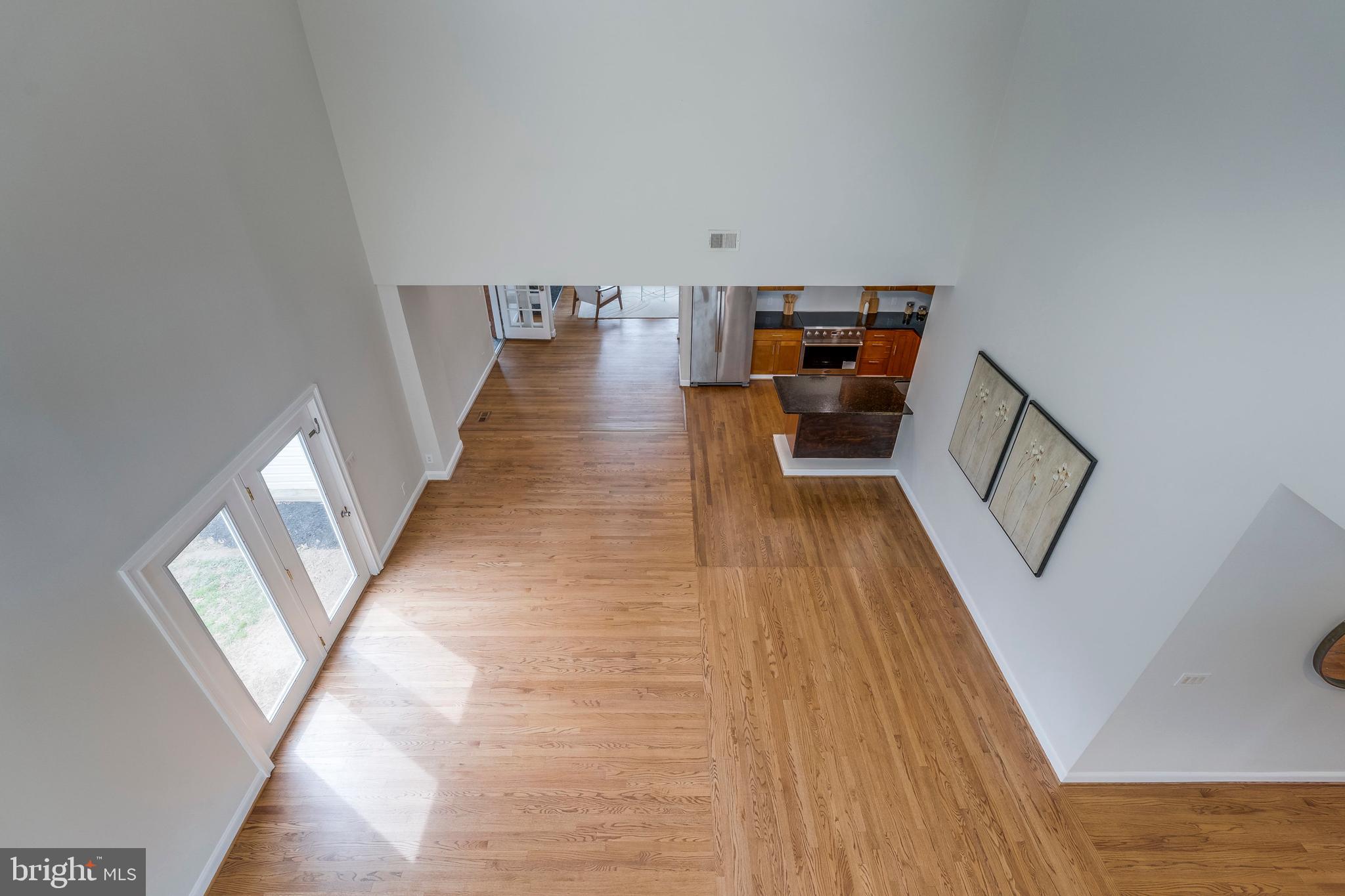 15001 Peach Orchard Road Silver Spring, MD 20905 - Photo 30 of 63 a view of entryway and hall with wooden floor