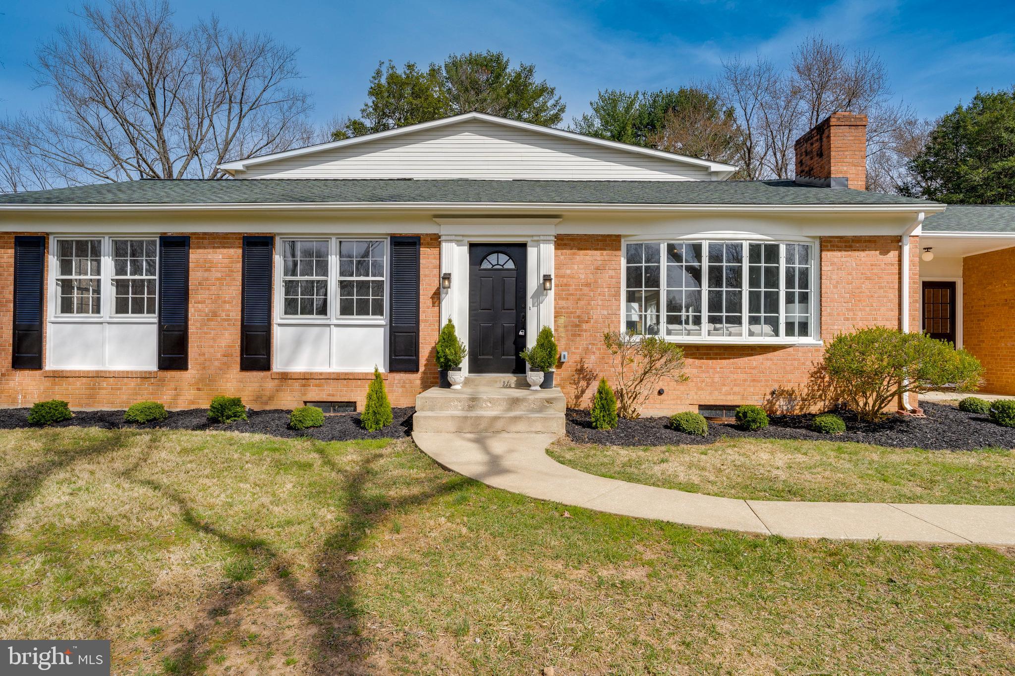 15001 Peach Orchard Road Silver Spring, MD 20905 - Photo 3 of 63 a front view of a house with garden