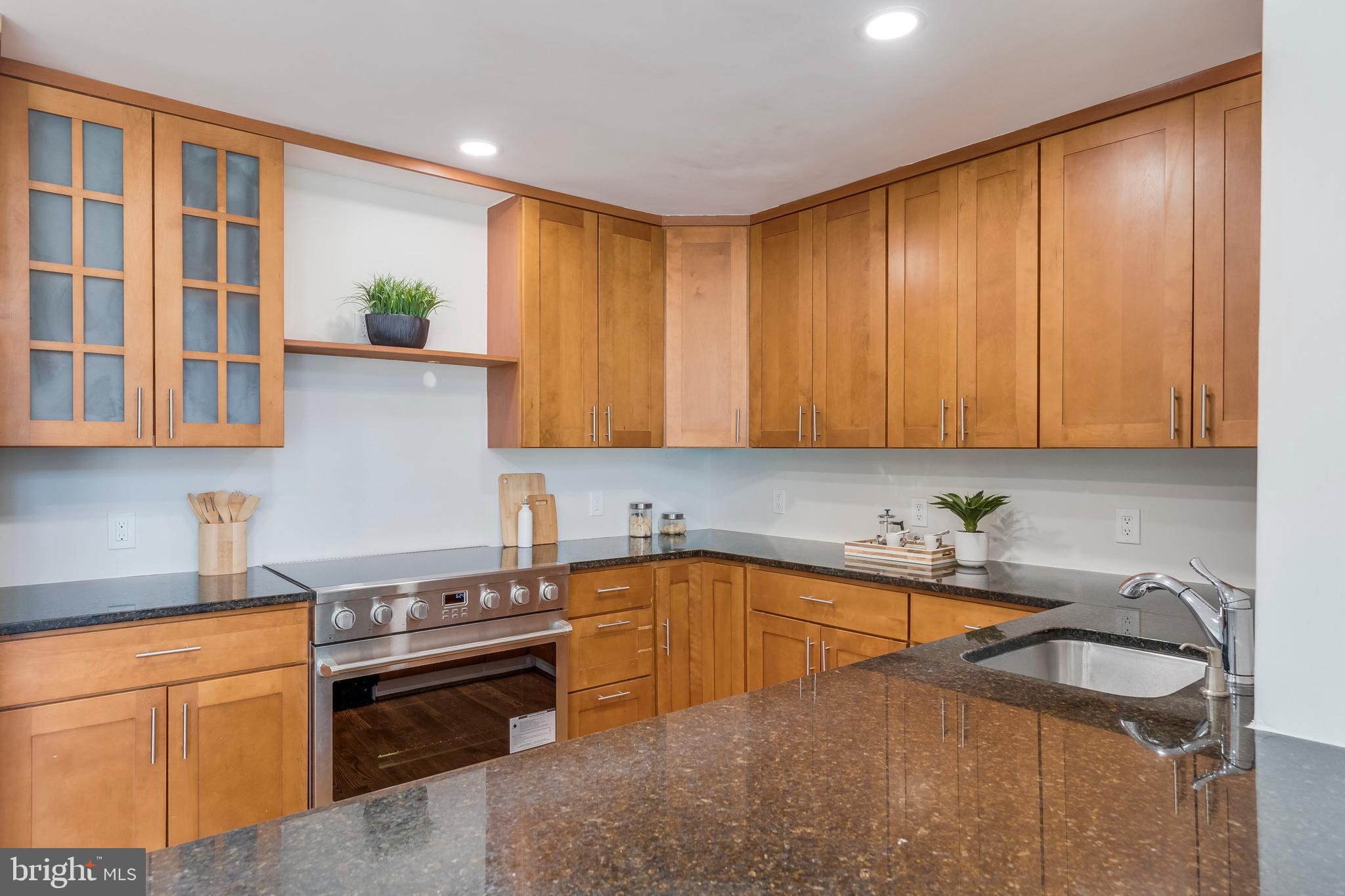 15001 Peach Orchard Road Silver Spring, MD 20905 - Photo 43 of 63 a kitchen that has a sink and a stove in it
