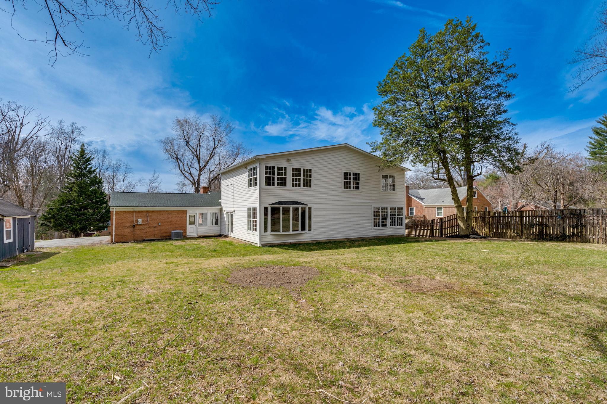 15001 Peach Orchard Road Silver Spring, MD 20905 - Photo 61 of 63 a view of a house with backyard and trees