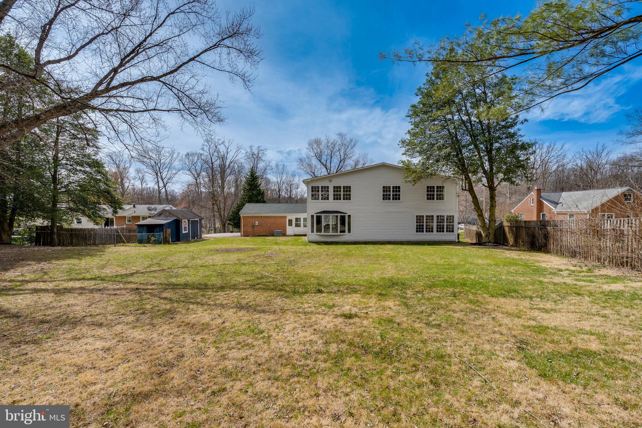 15001 Peach Orchard Road Silver Spring, MD 20905 - Photo 62 of 63 a front view of a house with a yard
