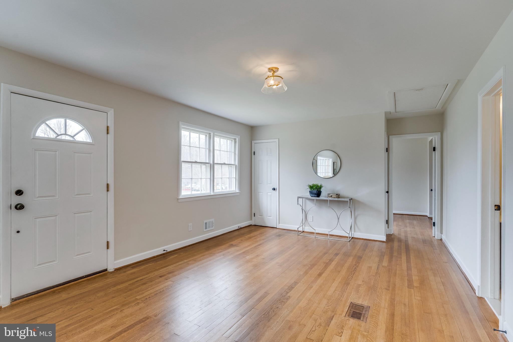 15001 Peach Orchard Road Silver Spring, MD 20905 - Photo 8 of 63 a view of a room with wooden floor and window