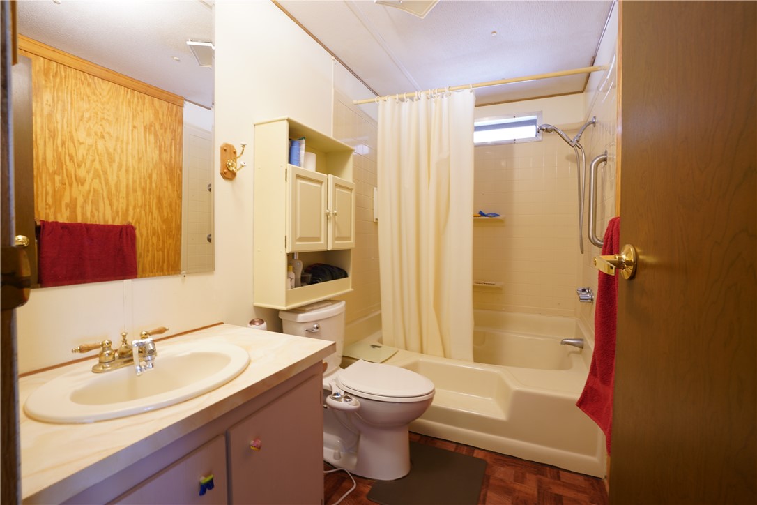 18193 Sequoia Drive Dolan Springs, AZ 86441 - Photo 18 of 50 a bathroom with a sink toilet tub and shower
