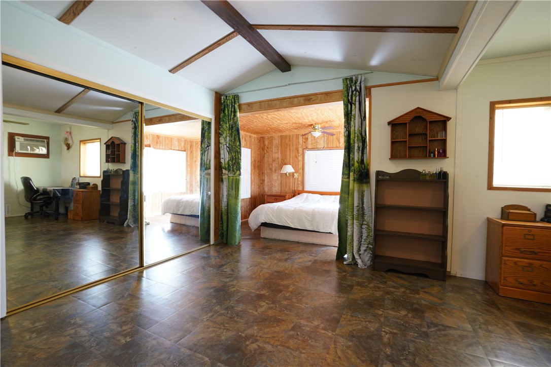 18193 Sequoia Drive Dolan Springs, AZ 86441 - Photo 19 of 50 a bedroom with wooden floor and furniture