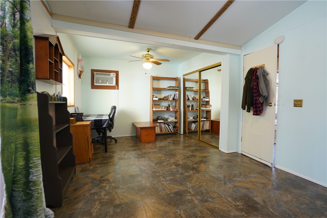 18193 Sequoia Drive Dolan Springs, AZ 86441 - Photo 21 of 50 a view of a livingroom with workspace and a window