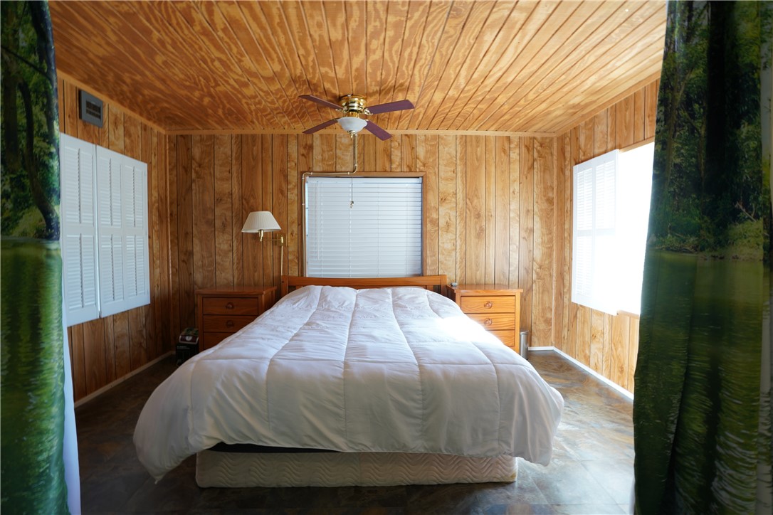 18193 Sequoia Drive Dolan Springs, AZ 86441 - Photo 22 of 50 a bedroom with a bed and a window