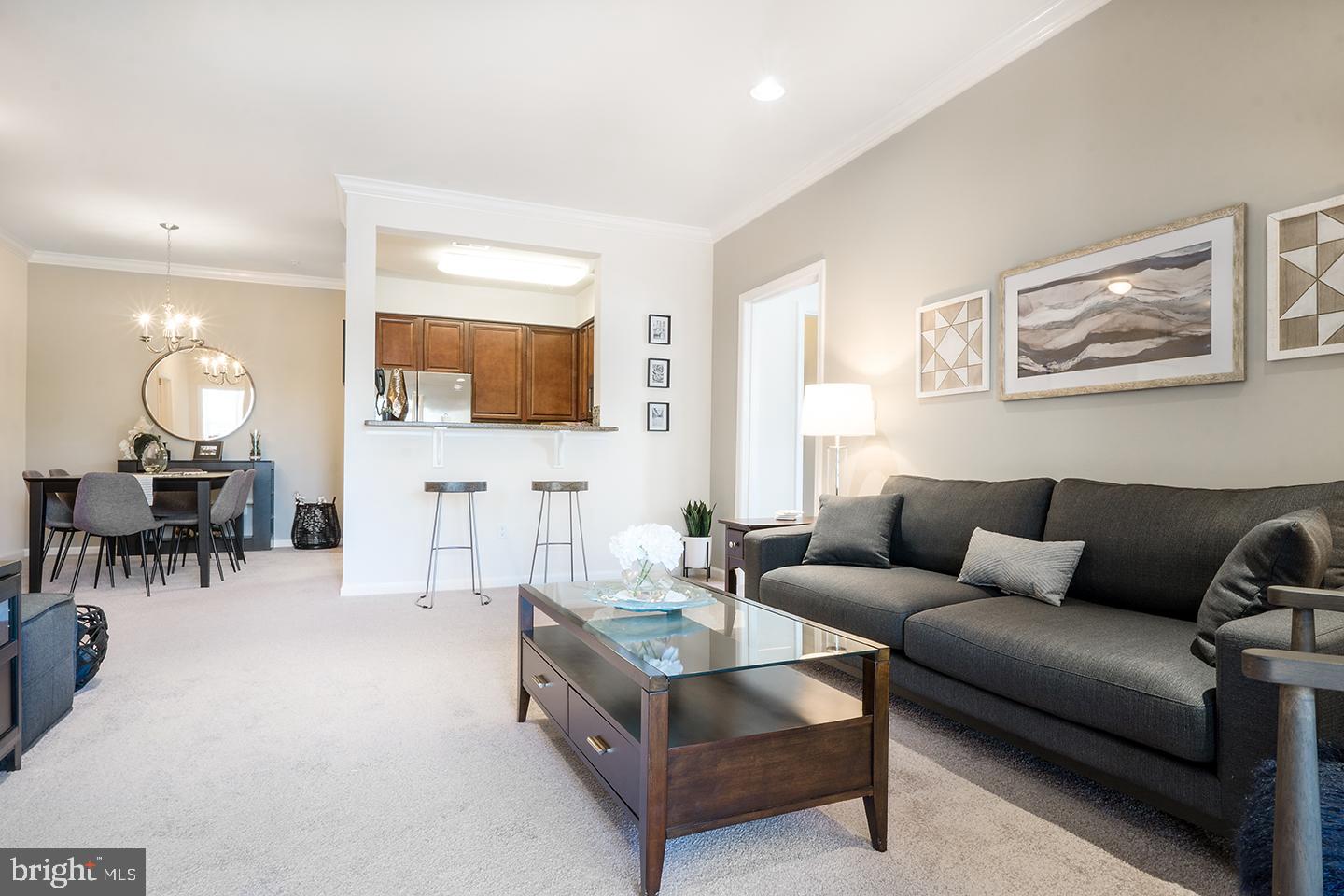 33 Tacoma Lane Hamilton, NJ 08619 - Photo 15 of 21 a living room with furniture and a dining area