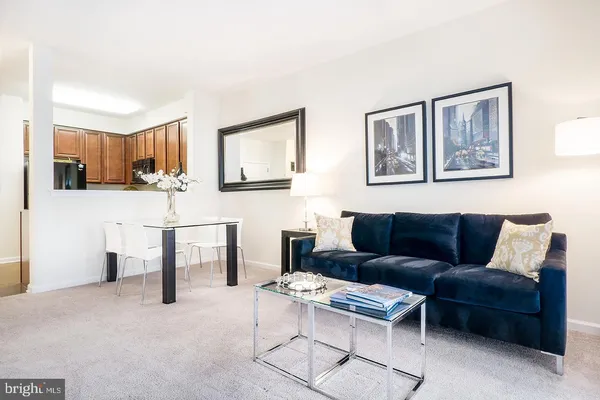 a living room with furniture and a table