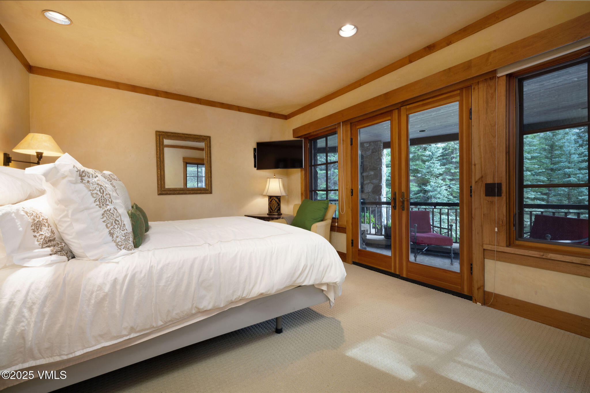 780 Potato Patch Drive Vail, CO 81657 - Photo 13 of 26 a bedroom with a large bed and a large window