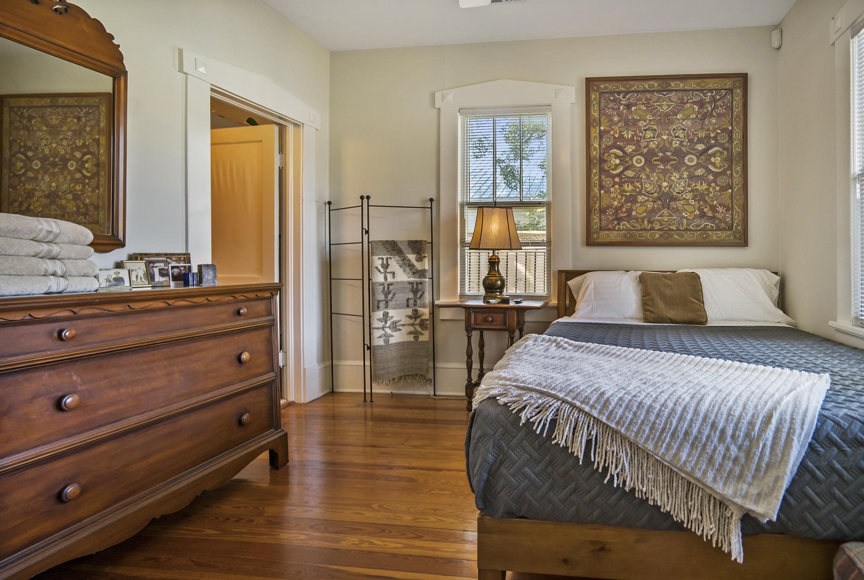 131 Washington Street St. Augustine, FL 32084 - Photo 11 of 33 a bedroom with a bed and wooden floor