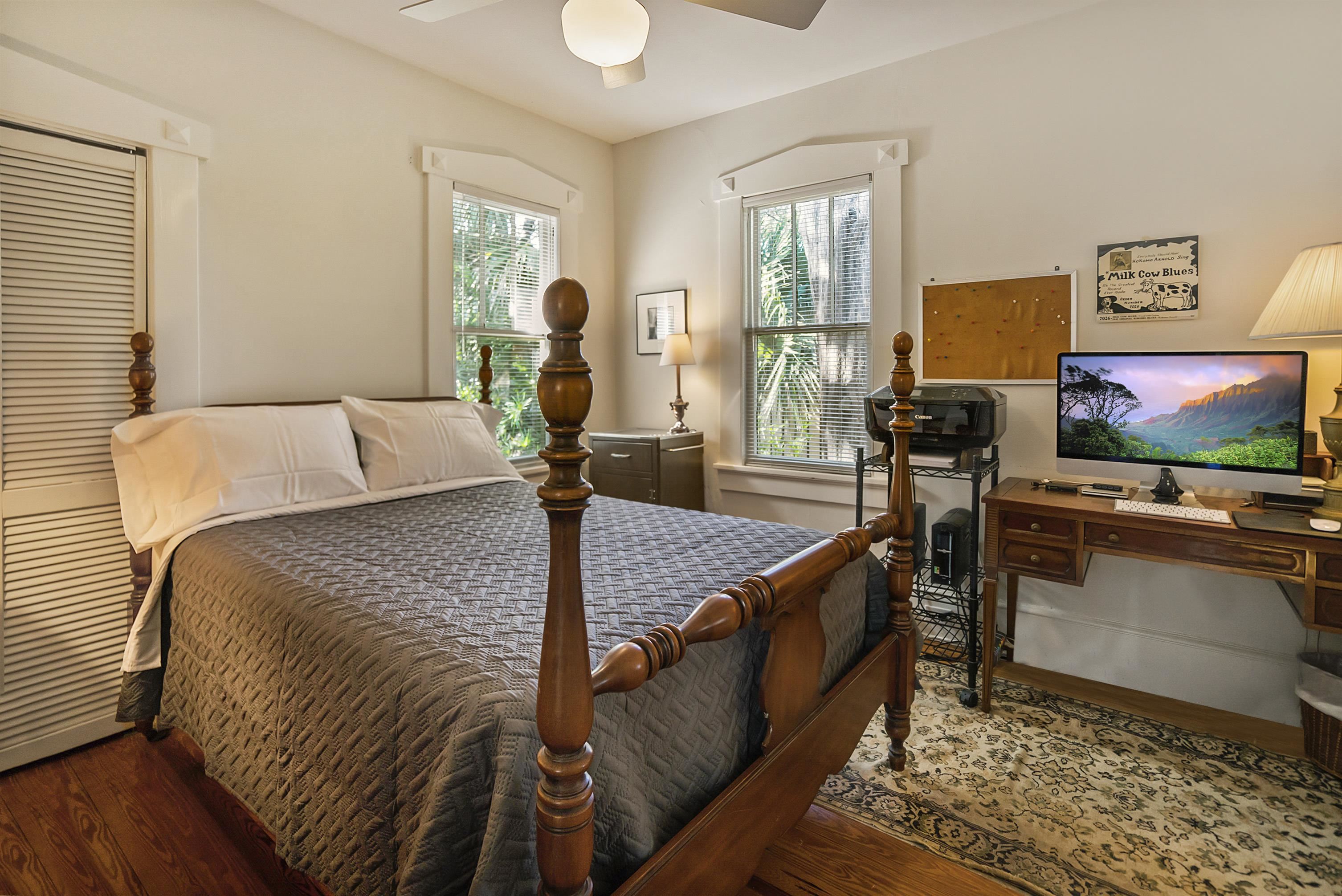 131 Washington Street St. Augustine, FL 32084 - Photo 15 of 33 a bed room with a bed and a flat screen tv