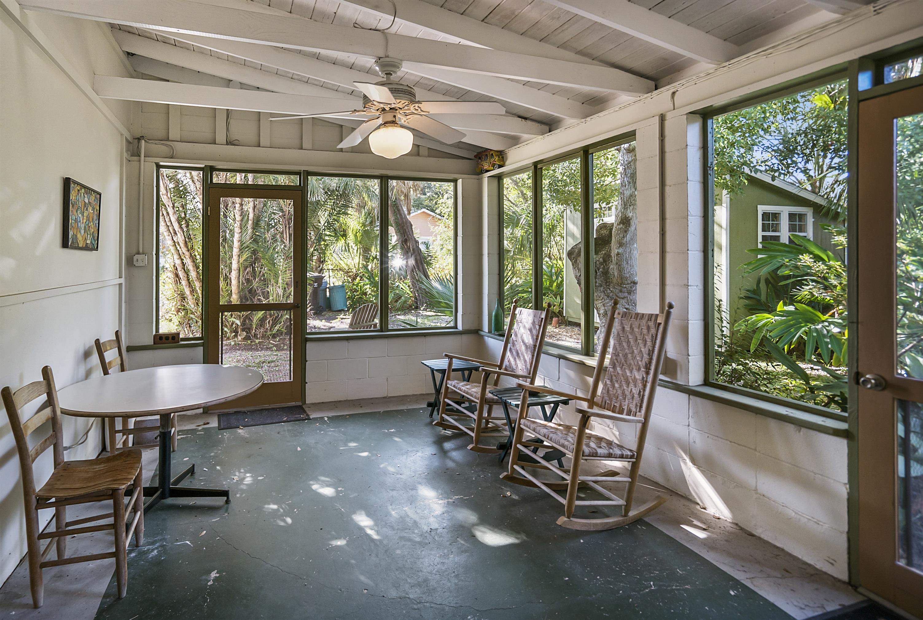 131 Washington Street St. Augustine, FL 32084 - Photo 19 of 33 a living room with furniture and a large window