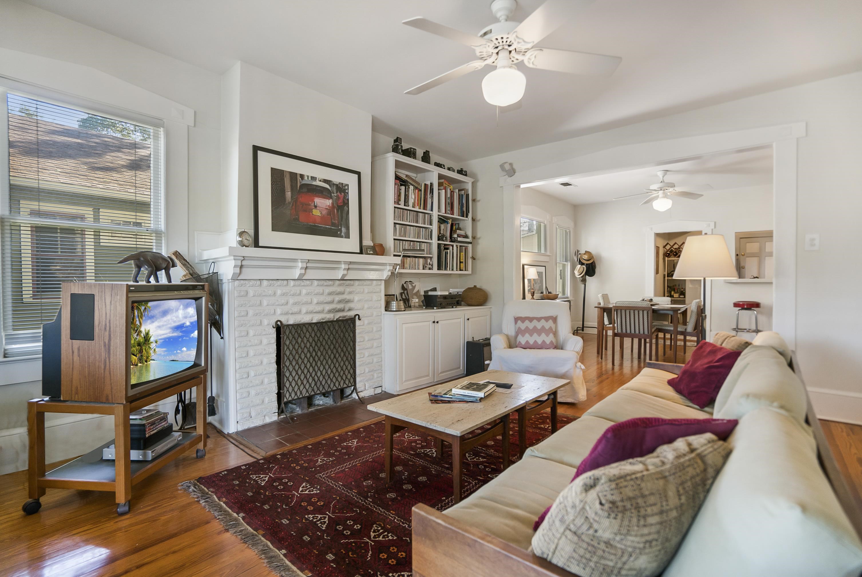 131 Washington Street St. Augustine, FL 32084 - Photo 3 of 33 a living room with furniture and a fireplace