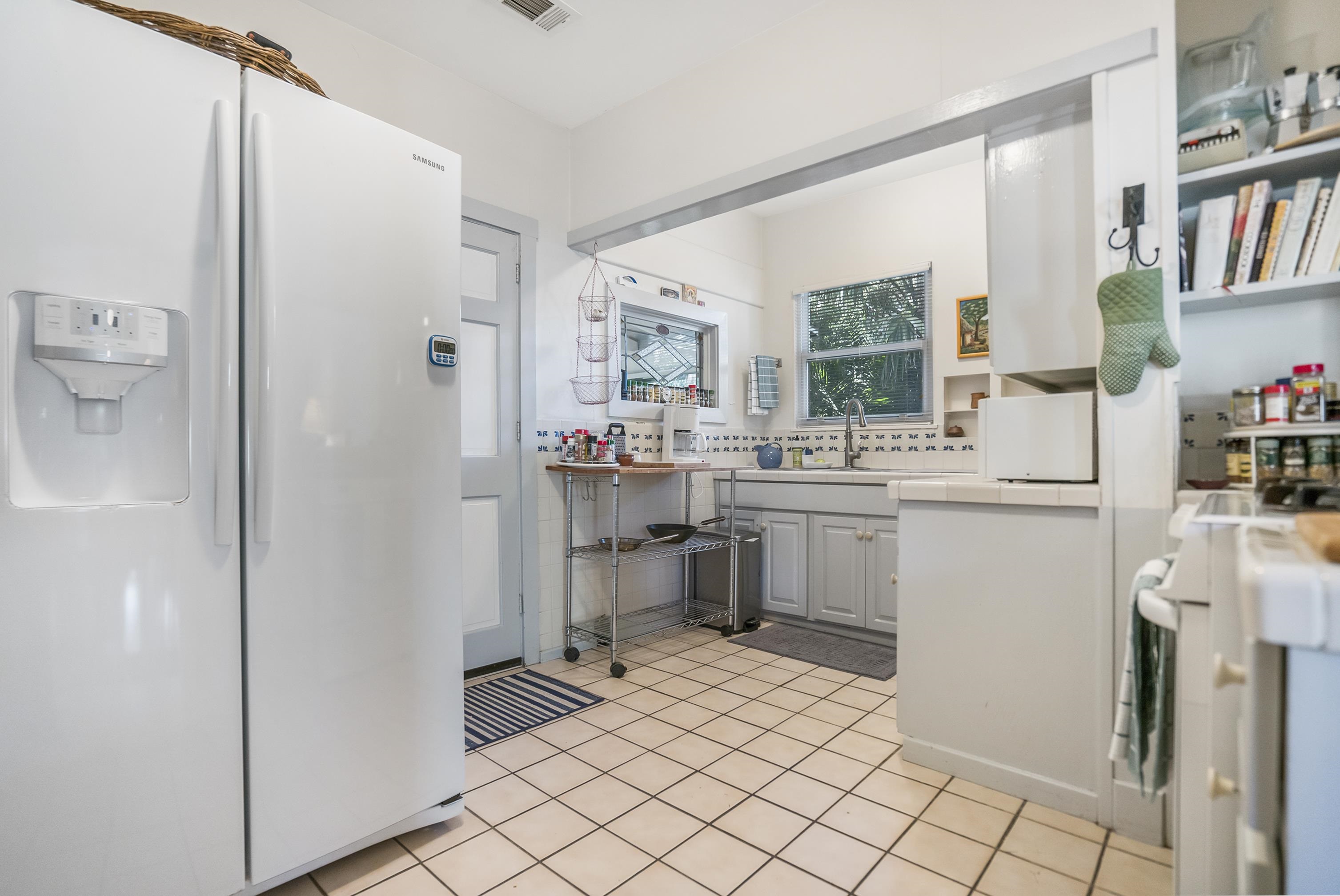 131 Washington Street St. Augustine, FL 32084 - Photo 7 of 33 a room with a sink and a refrigerator