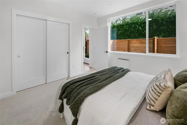 a bedroom with a bed and window