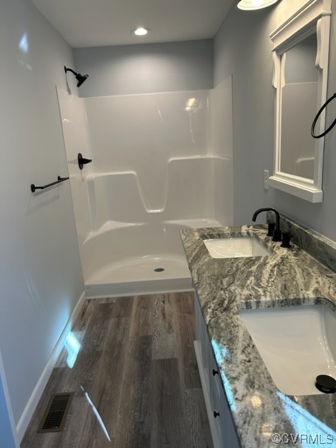 10234 Doyle Boulevard McKenney, VA 23872 - Photo 9 of 10 a bathroom with a granite countertop sink a toilet and shower