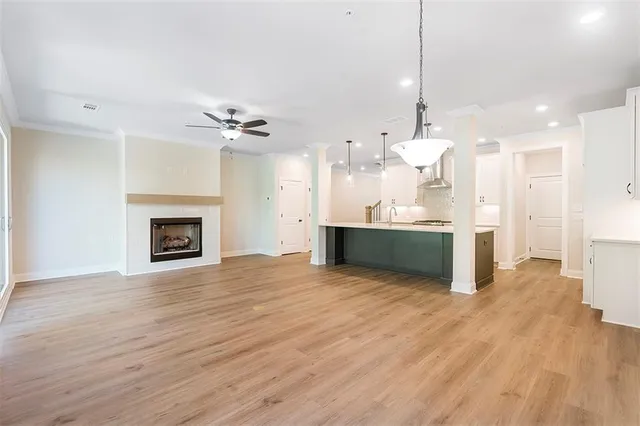a view of a kitchen with a sink and a kitchen view