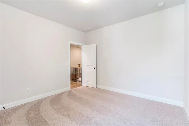 a bathroom with a sink a toilet a mirror a bathtub and shower