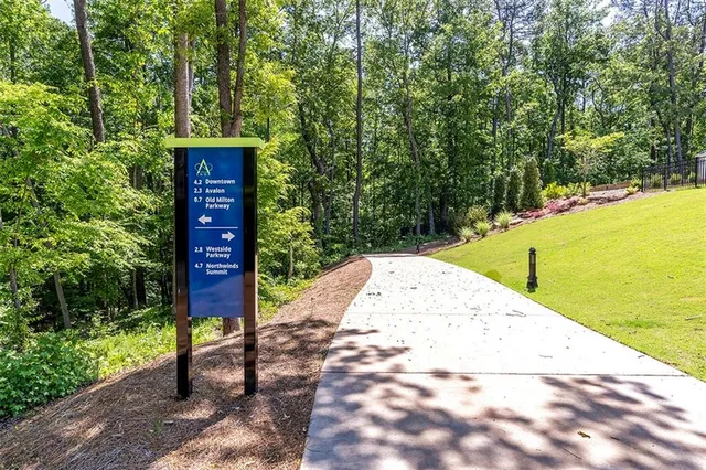 a swimming pool with outdoor seating and yard