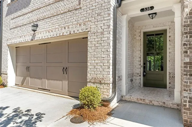 a view of a wooden door of the house